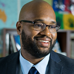 man with beard in suit and glasses